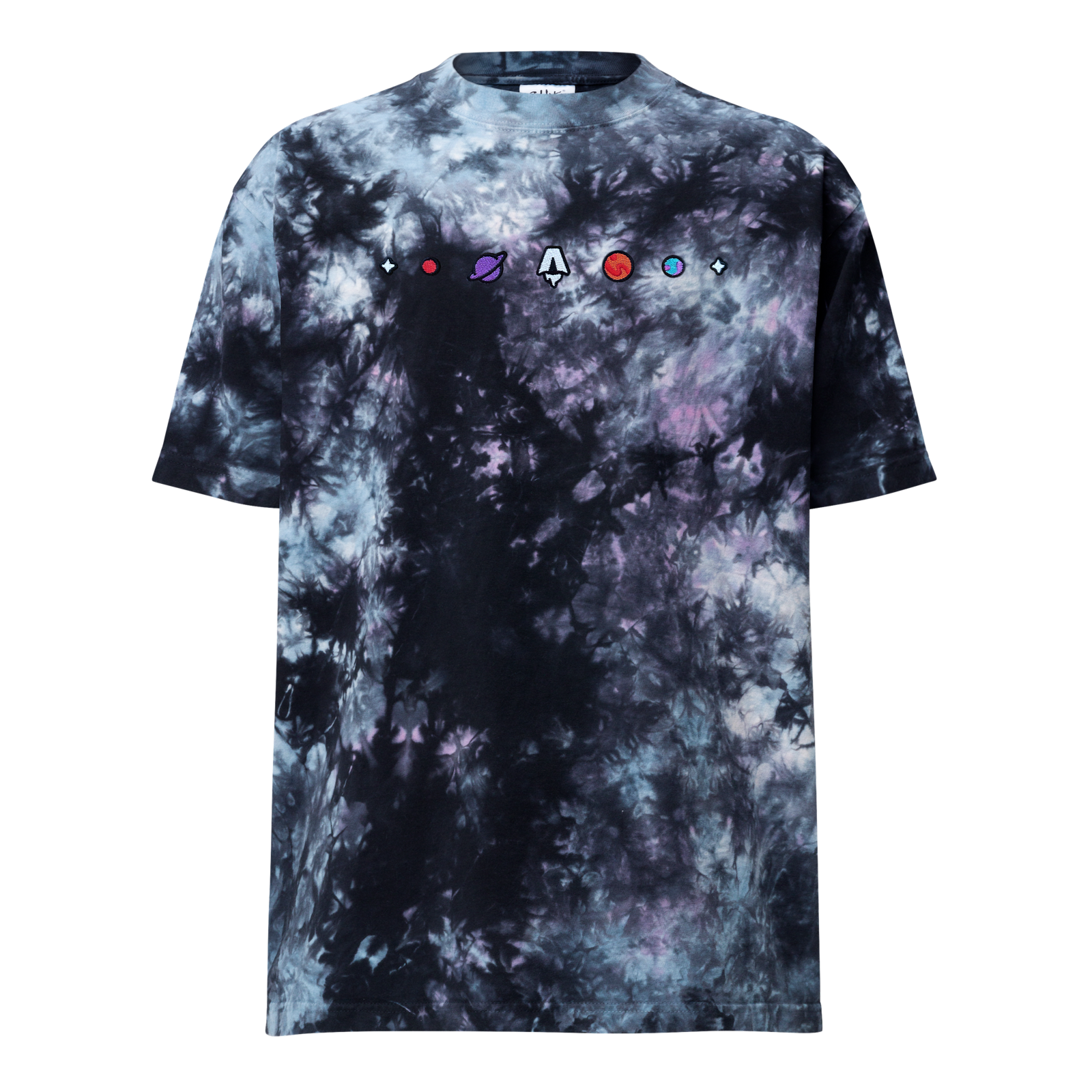 A tie-dye t-shirt in black, indigo, and purple shades with a row of embroidered patches across the chest. At the center is an Astro logo. There are two planets on either side and the row starts and ends with a small embroidered four-pointed star.